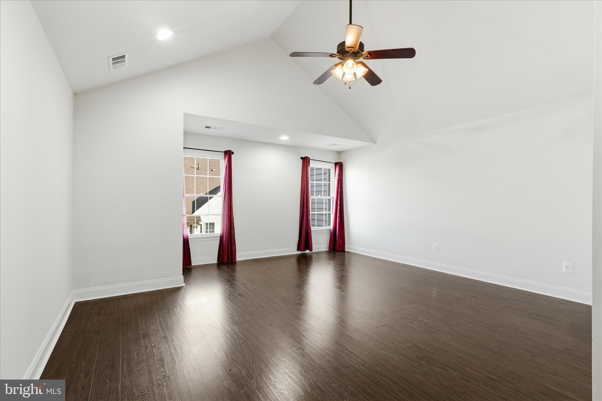 22908 North Brown Square Ashburn, VA 20148 - Photo 30 of 57 an empty room with wooden floor ceiling fan and window