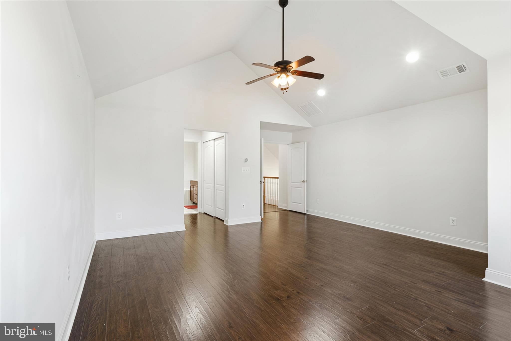 22908 North Brown Square Ashburn, VA 20148 - Photo 32 of 57 a view of an empty room with wooden floor