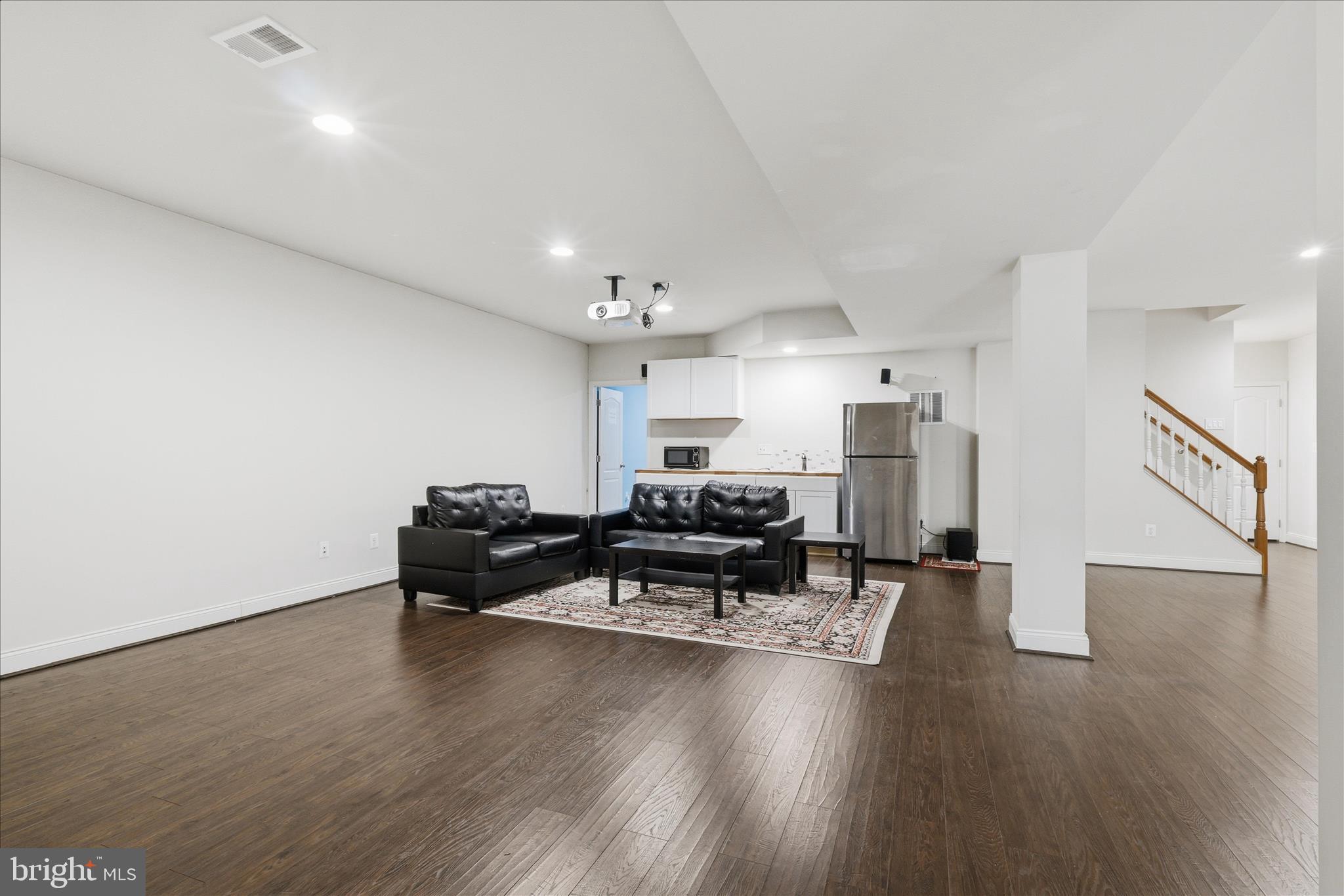 22908 North Brown Square Ashburn, VA 20148 - Photo 41 of 57 a living room with furniture and a wooden floor