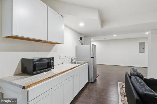 a bathroom with a sink toilet and a mirror