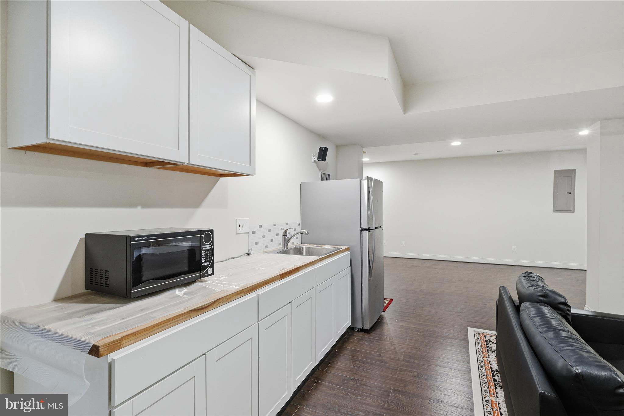 22908 North Brown Square Ashburn, VA 20148 - Photo 43 of 57 a kitchen with refrigerator and microwave