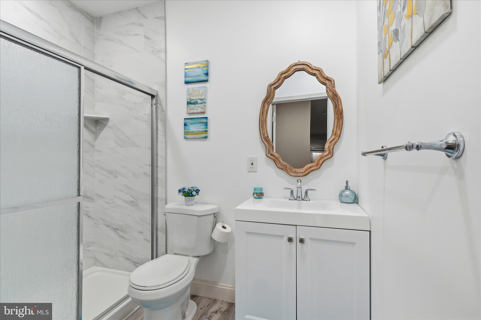 22908 North Brown Square Ashburn, VA 20148 - Photo 45 of 57 a bathroom with a sink toilet and a mirror
