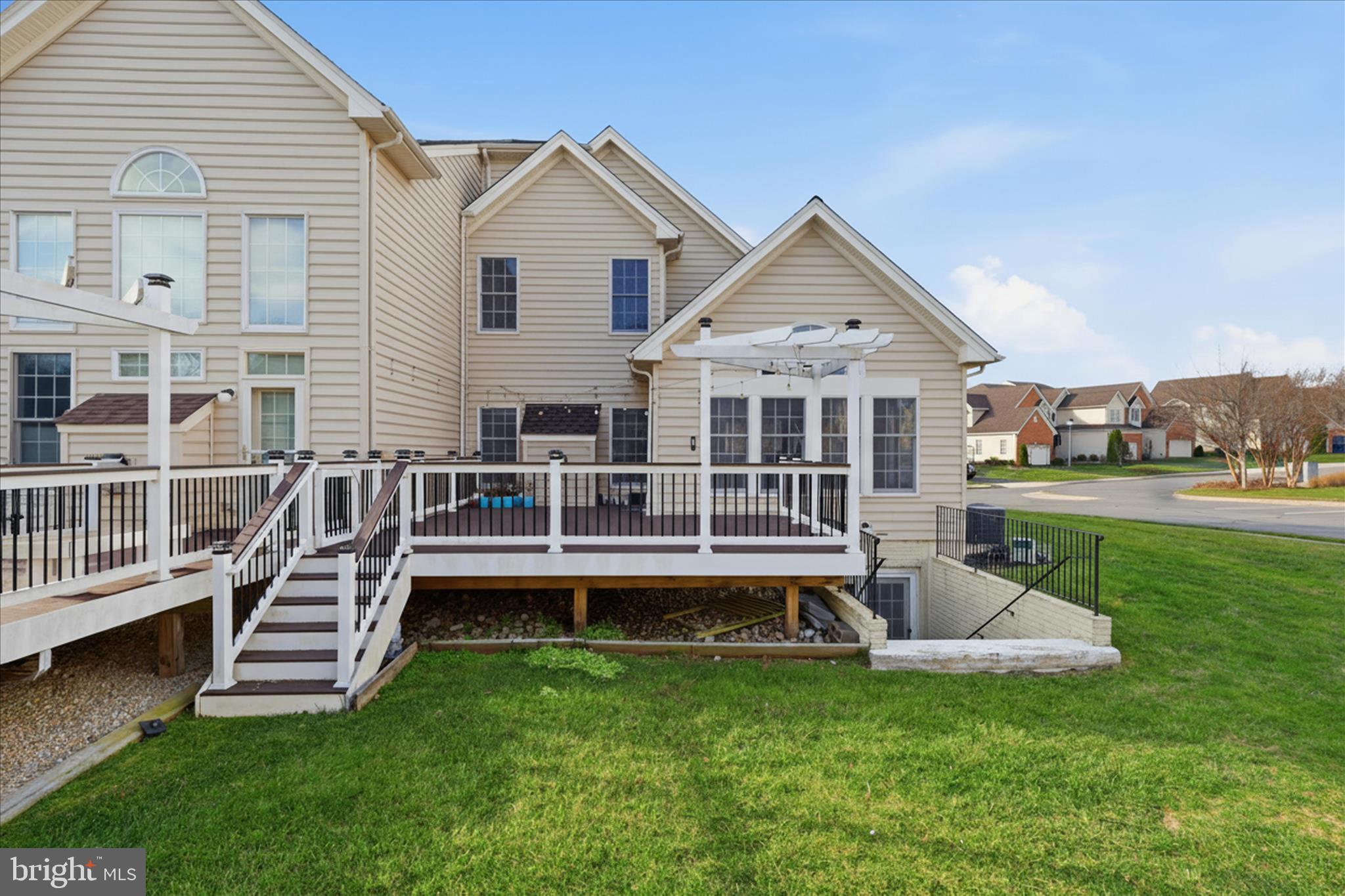 22908 North Brown Square Ashburn, VA 20148 - Photo 46 of 57 a view of a house with a yard and sitting area