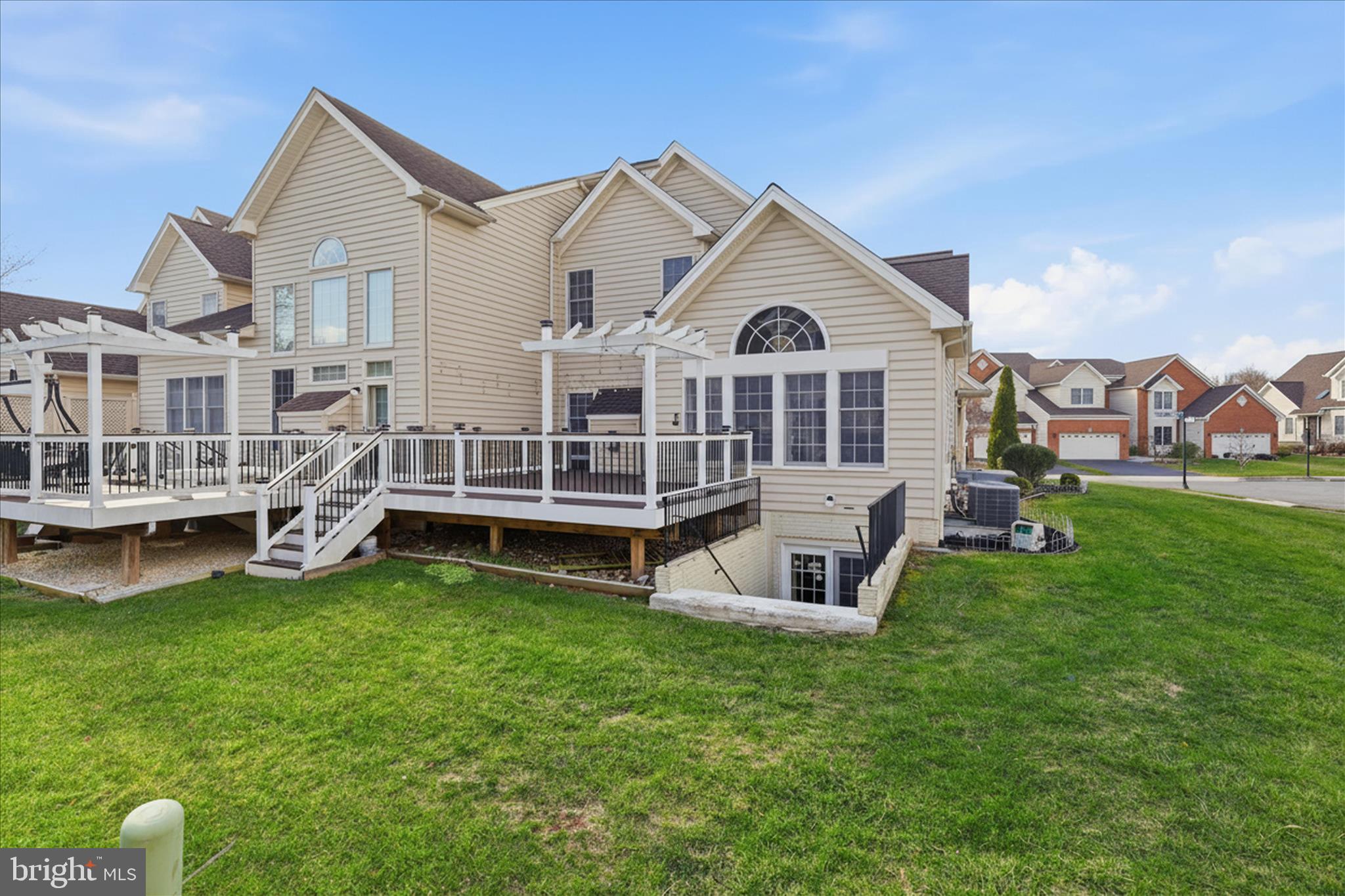 22908 North Brown Square Ashburn, VA 20148 - Photo 47 of 57 a view of a house with a yard and sitting area