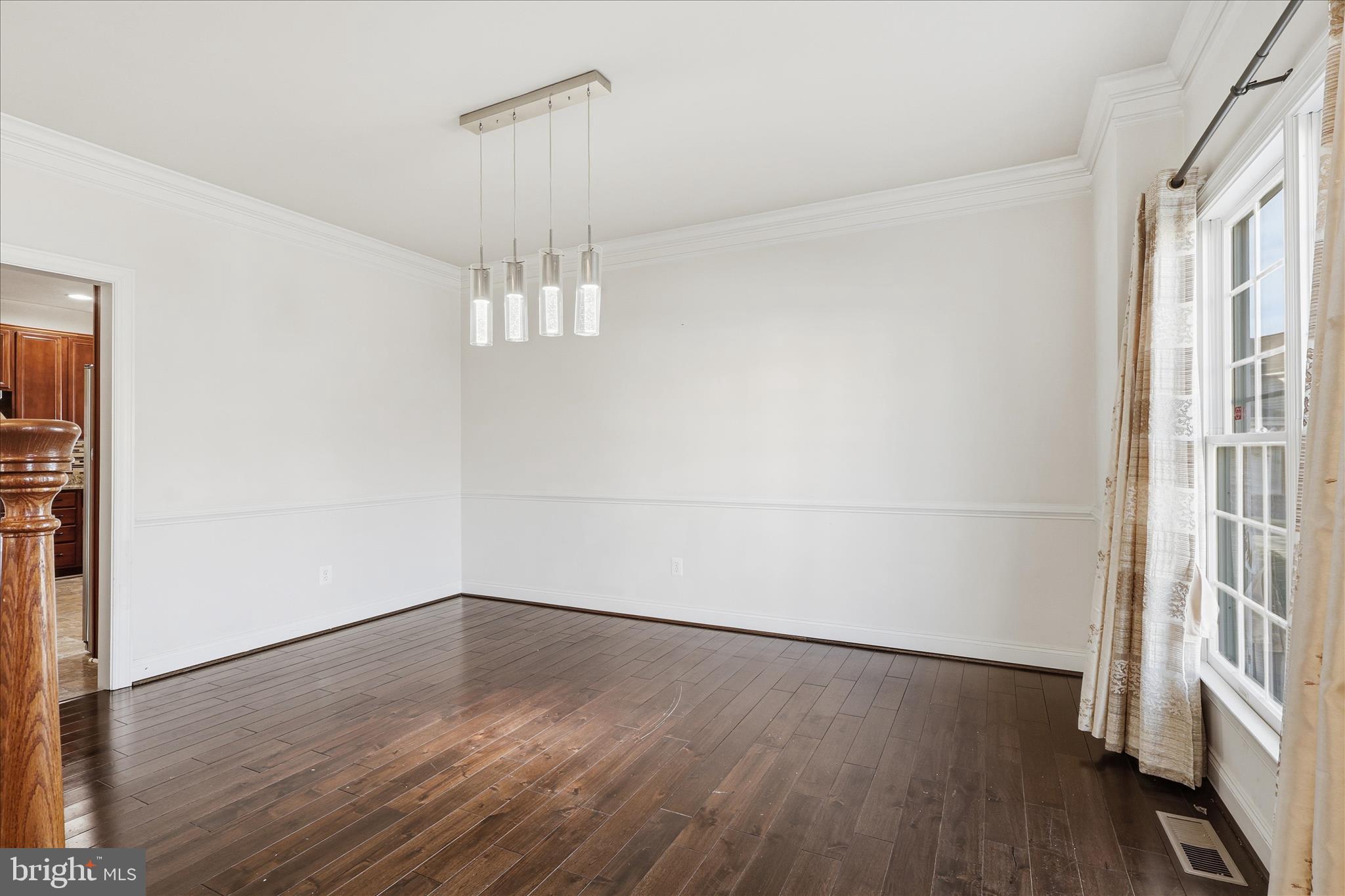 22908 North Brown Square Ashburn, VA 20148 - Photo 7 of 57 wooden floor in an empty room with a window