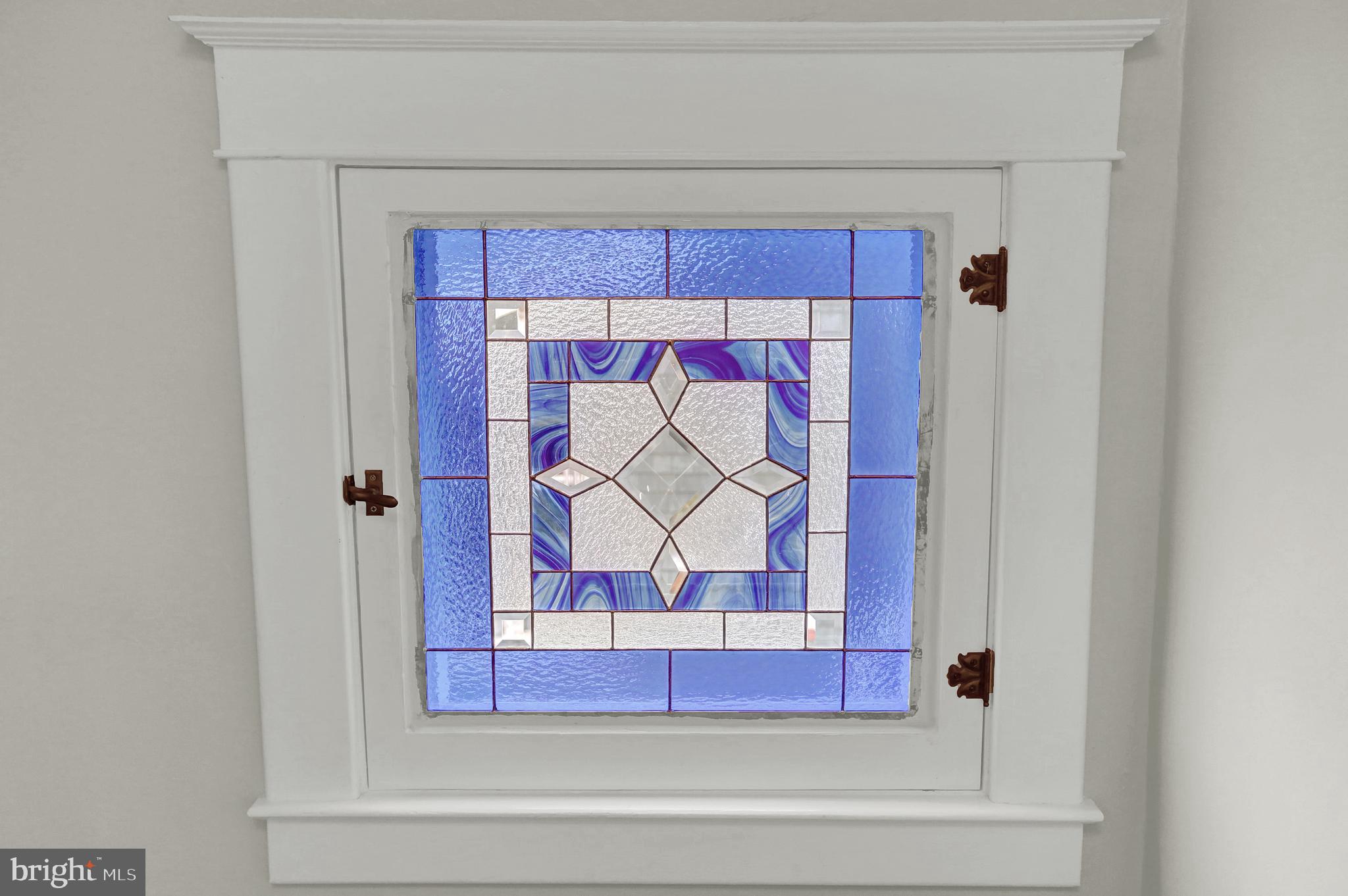 616 Hollen Road Baltimore, MD 21212 - Photo 18 of 39 Stained glass window at top of second level steps