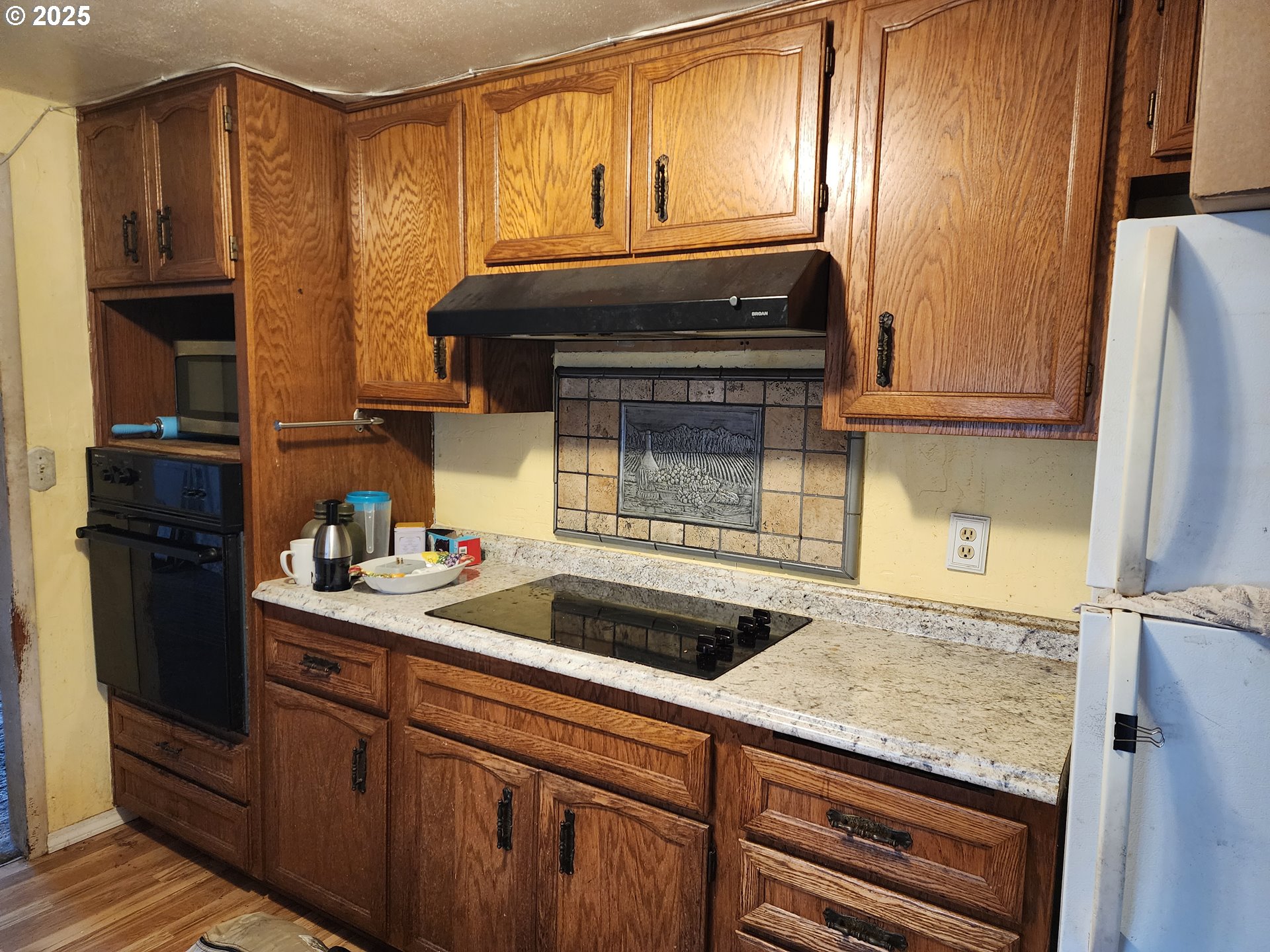 2345 F Street Springfield, OR 97477 - Photo 4 of 20 a kitchen with granite countertop a sink stove and cabinets