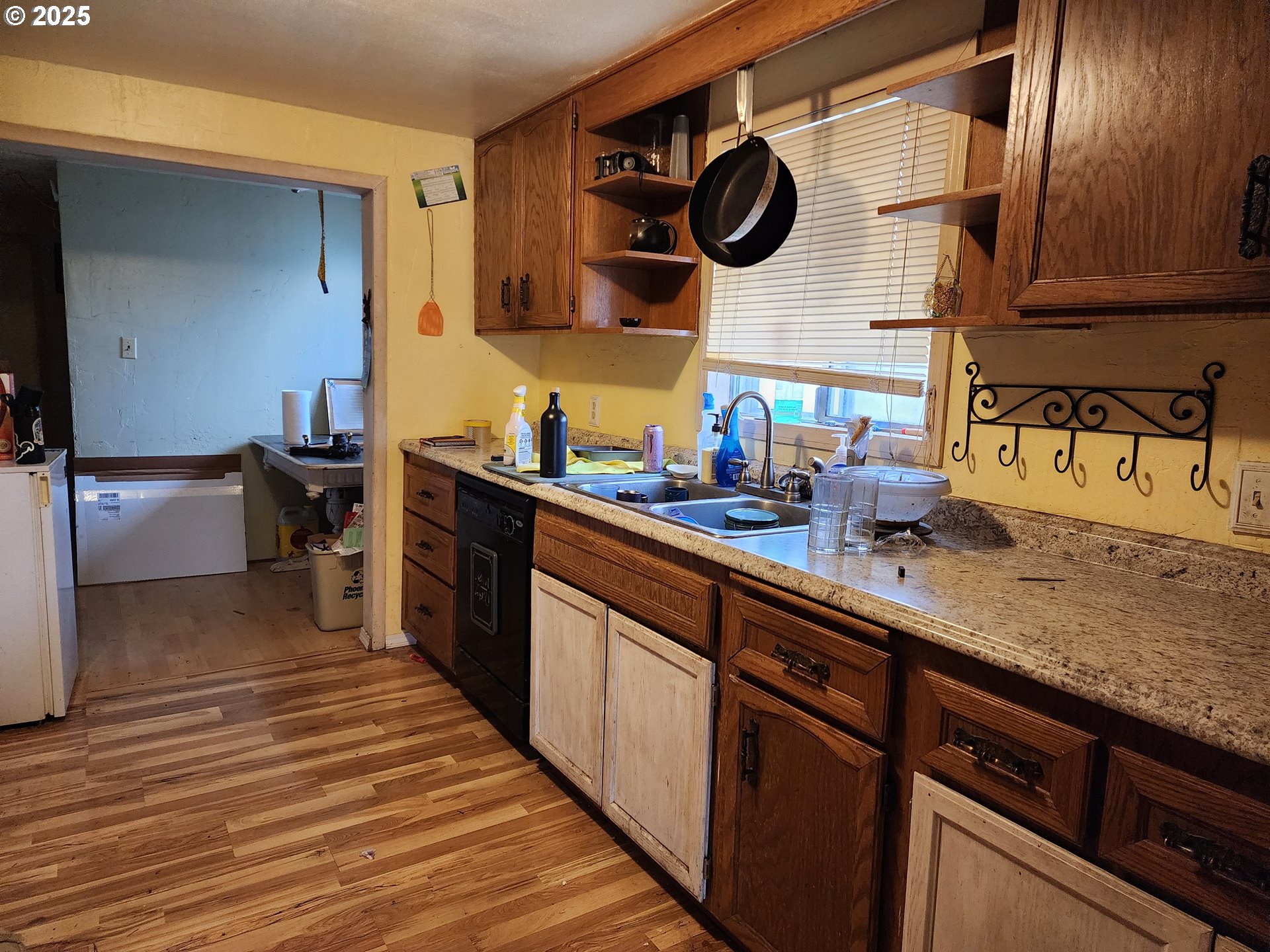 2345 F Street Springfield, OR 97477 - Photo 5 of 20 a kitchen with a sink and a stove with wooden floor