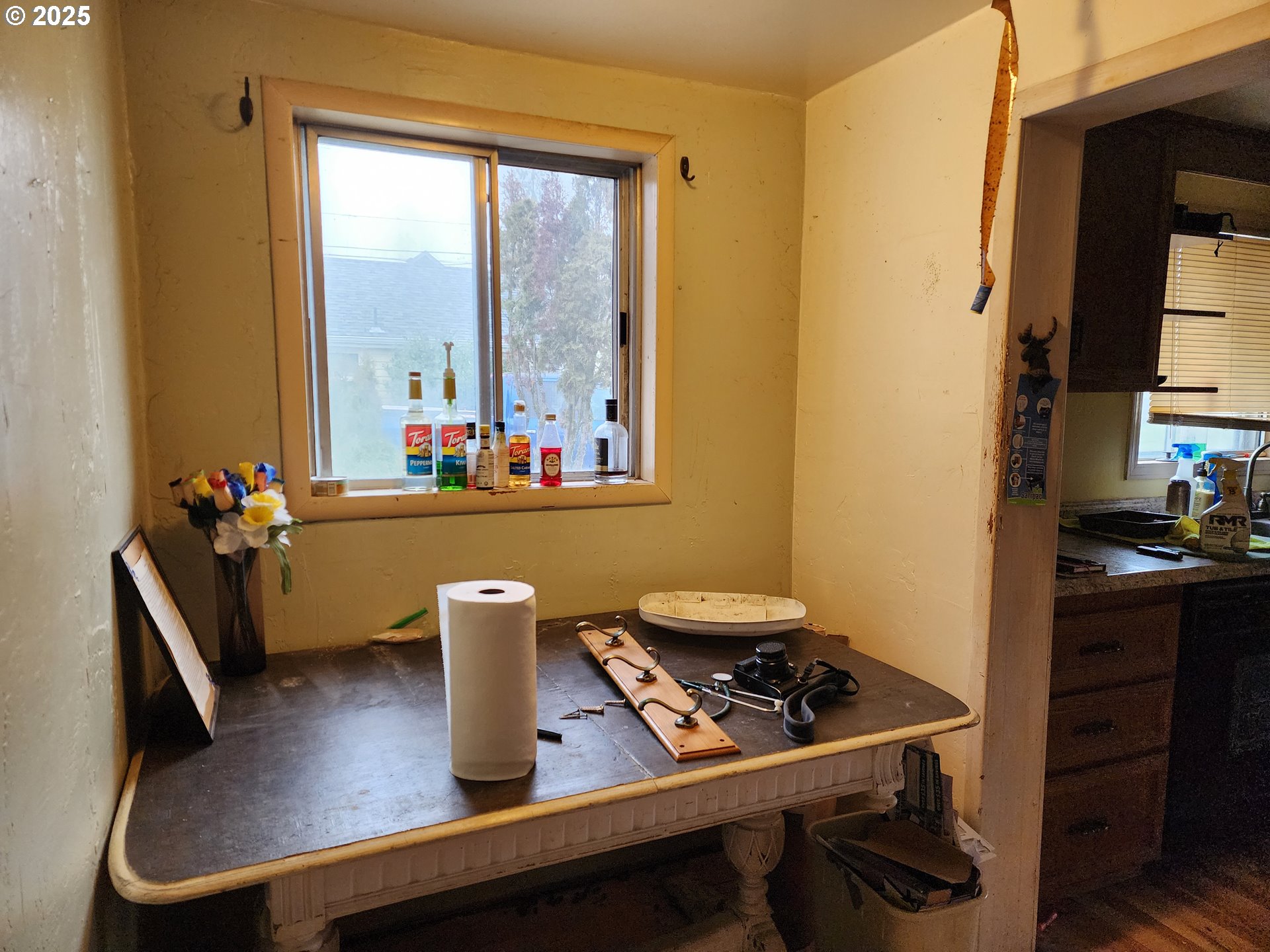 2345 F Street Springfield, OR 97477 - Photo 9 of 20 a view of a workspace with furniture and a window