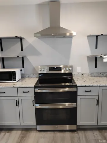 a room with a refrigerator and a shelf