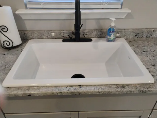 a view of a workspace with furniture and a gate