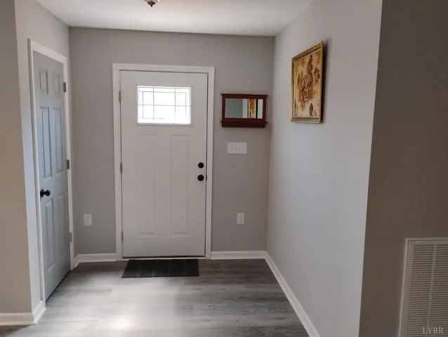 a room with furniture and wooden floor