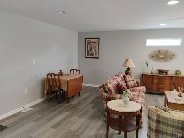 a kitchen with stainless steel appliances a sink cabinets and wooden floor