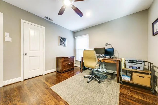 a view of a workspace with furniture and a workspace