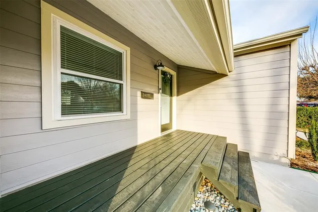 a view of backyard with wooden floor and a window