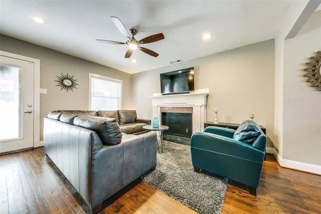 a living room with furniture and a fireplace