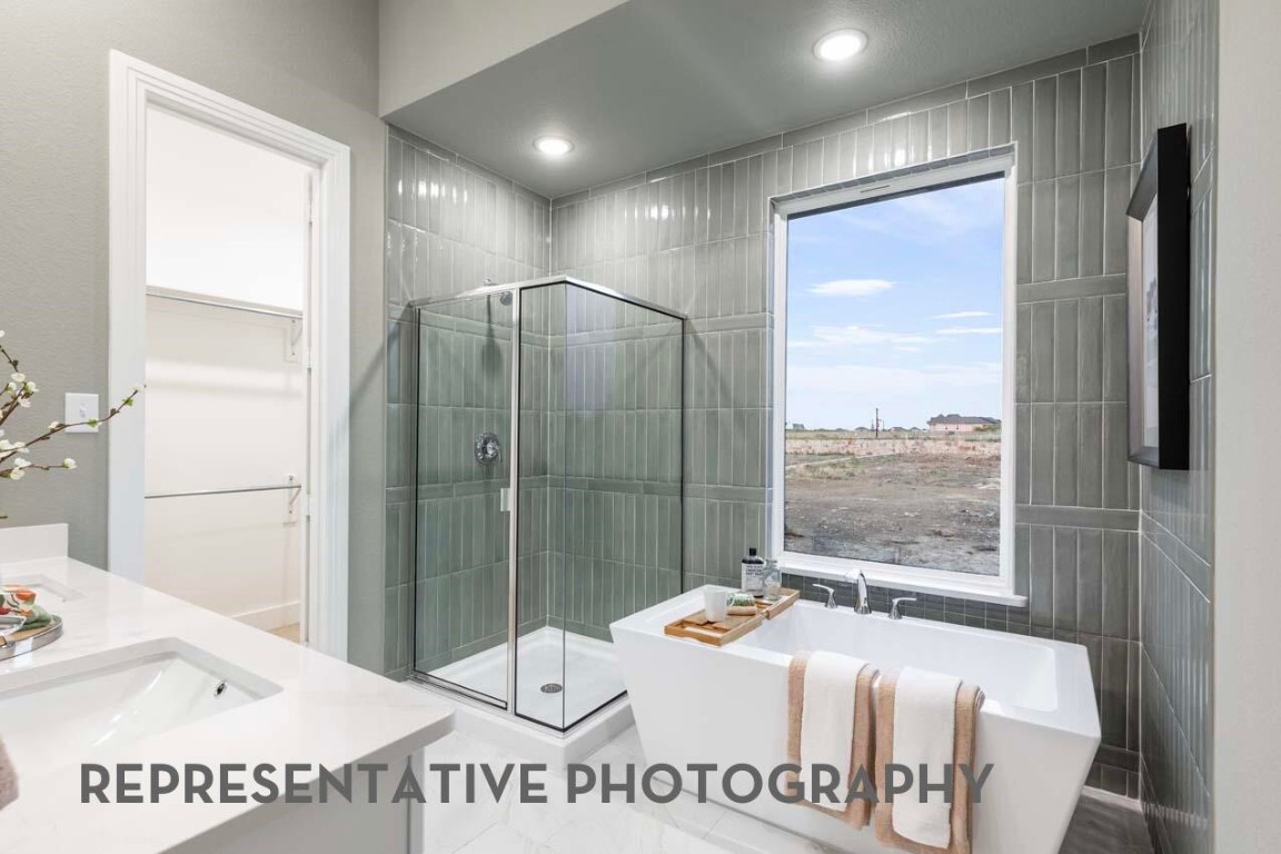 5331 Murillo Drive Manvel, TX 77578 - Photo 10 of 20 a en suite bathroom with a granite countertop sink and a mirror