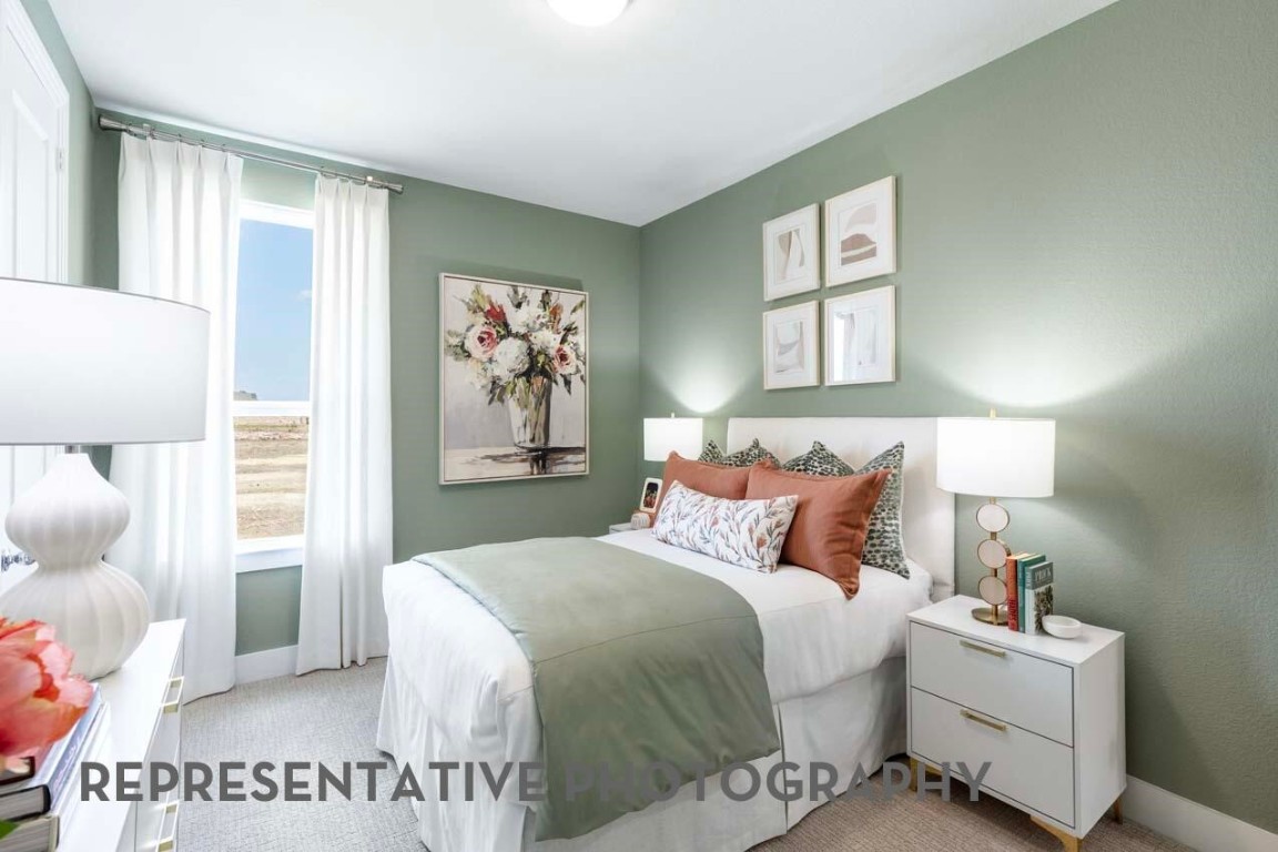 5331 Murillo Drive Manvel, TX 77578 - Photo 11 of 20 a bedroom with a large bed and a window