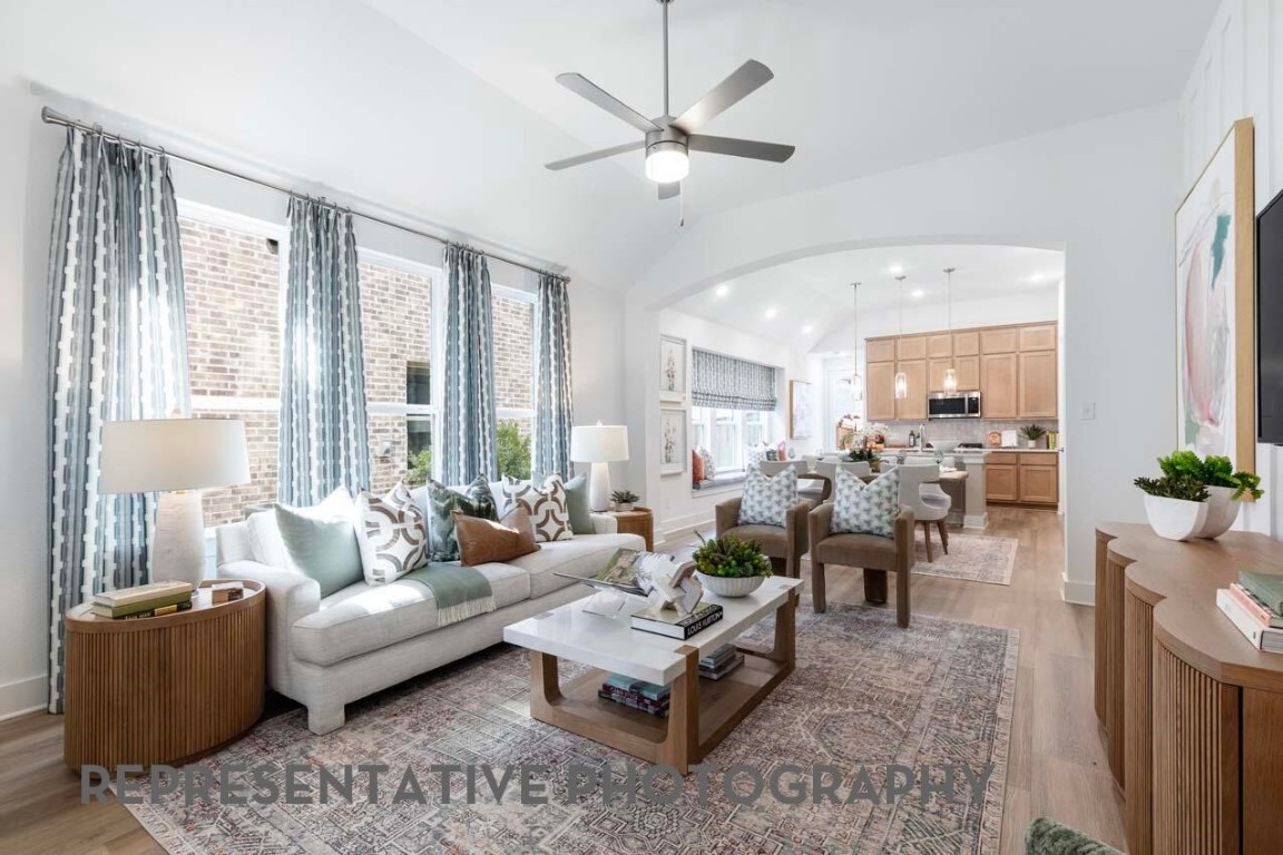 5331 Murillo Drive Manvel, TX 77578 - Photo 6 of 20 a living room with furniture potted plant and a large window