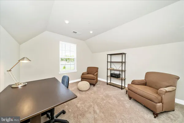 a bedroom with furniture and a bed