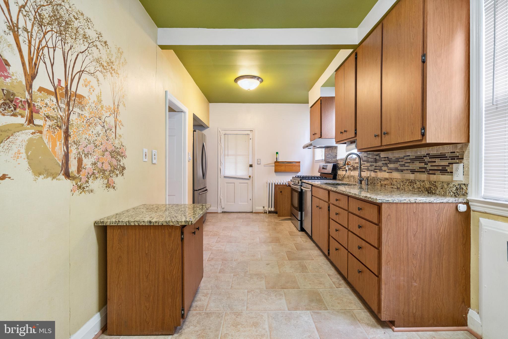 4826 Coleherne Road Baltimore, MD 21229 - Photo 15 of 44 Granite Counters and Stainless Steel Appliances
