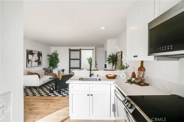 a view of living room with furniture and flat screen tv