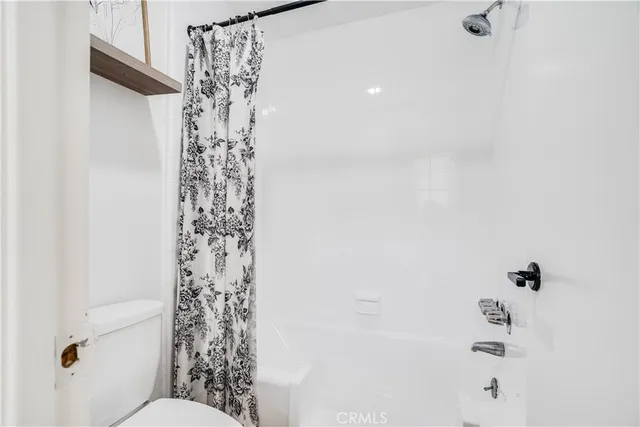 a bathroom with a shower curtain