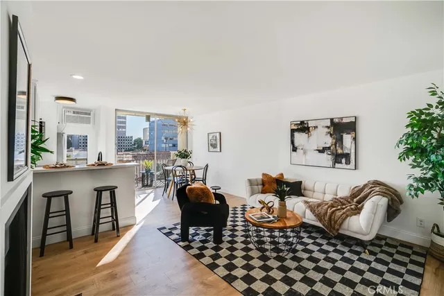 a bedroom with furniture a rug and a window