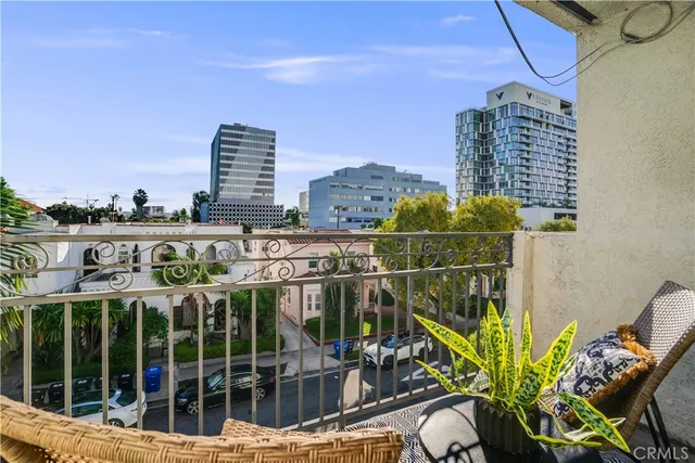 a view of a balcony with chairs