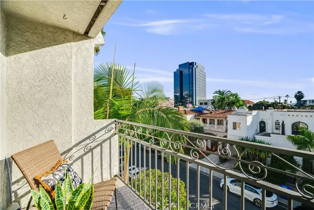 a view of a balcony with chairs