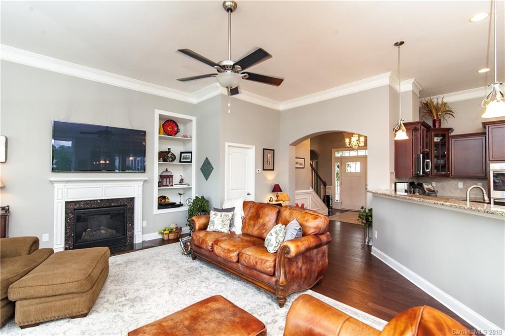 79026 Ridgehaven Road Lancaster, SC 29720 - Photo 12 of 30 a living room with furniture and a fireplace