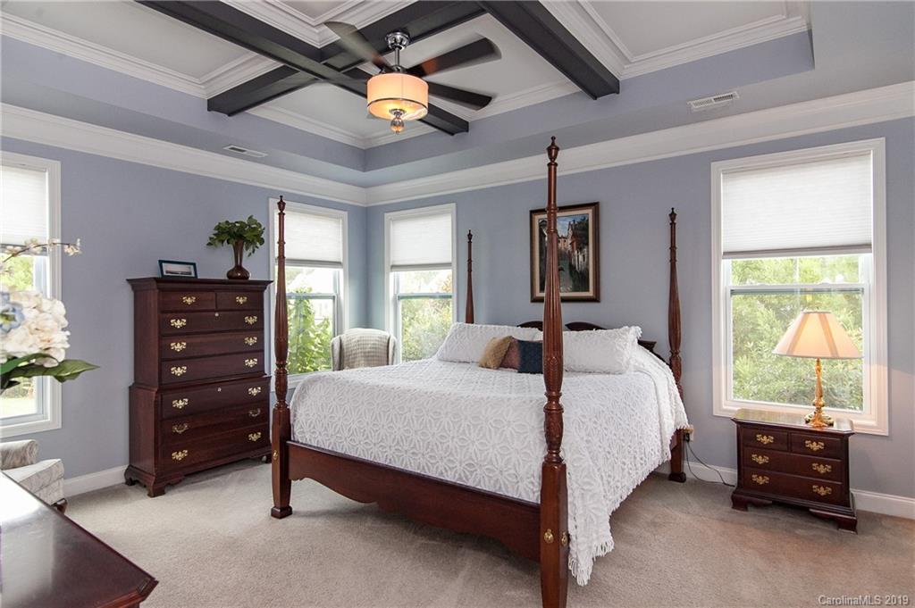 79026 Ridgehaven Road Lancaster, SC 29720 - Photo 15 of 30 a bedroom with a bed and a dresser