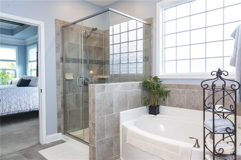 79026 Ridgehaven Road Lancaster, SC 29720 - Photo 18 of 30 a bathroom with a tub shower and sink