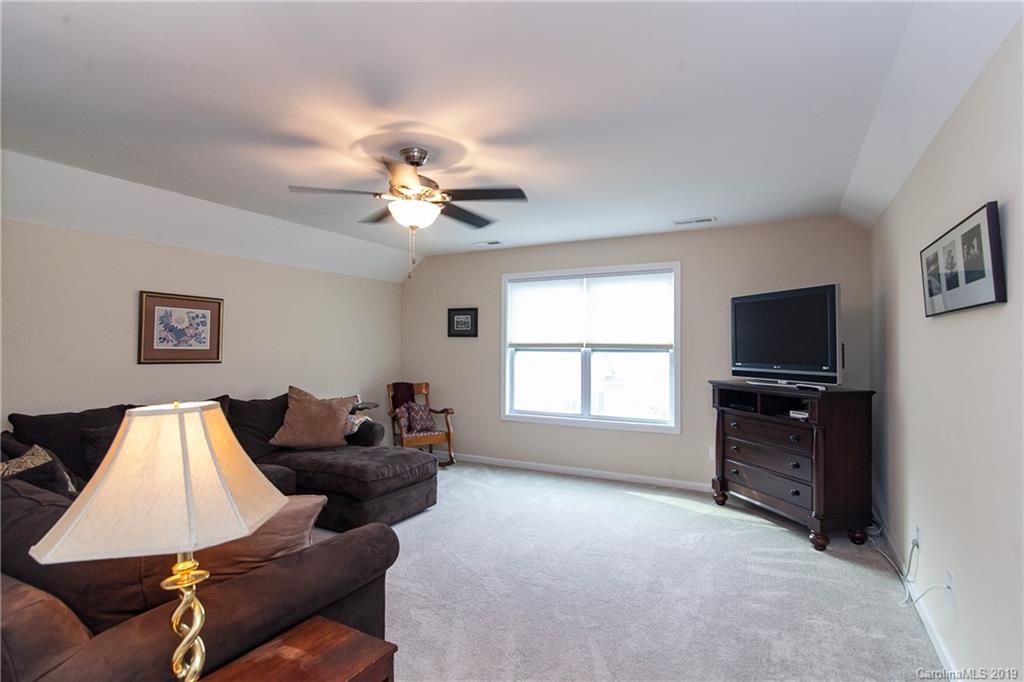 79026 Ridgehaven Road Lancaster, SC 29720 - Photo 20 of 30 a living room with furniture a flat screen tv and a window