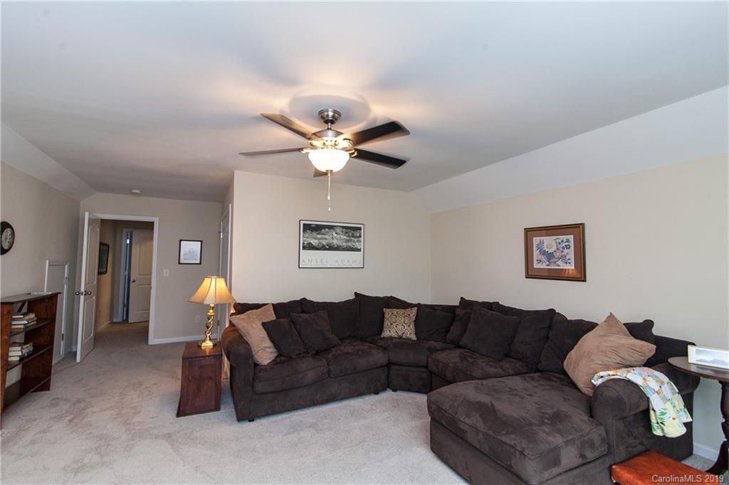 79026 Ridgehaven Road Lancaster, SC 29720 - Photo 21 of 30 a living room with furniture a chandelier and a window