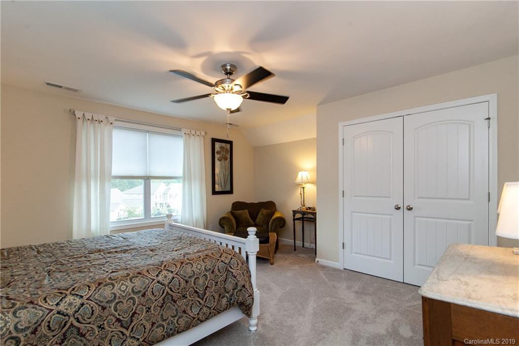 79026 Ridgehaven Road Lancaster, SC 29720 - Photo 22 of 30 a spacious bedroom with a bed and a table in it