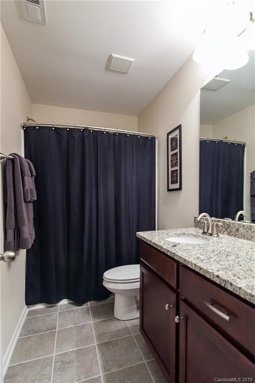 79026 Ridgehaven Road Lancaster, SC 29720 - Photo 23 of 30 a bathroom with a granite countertop sink and a mirror