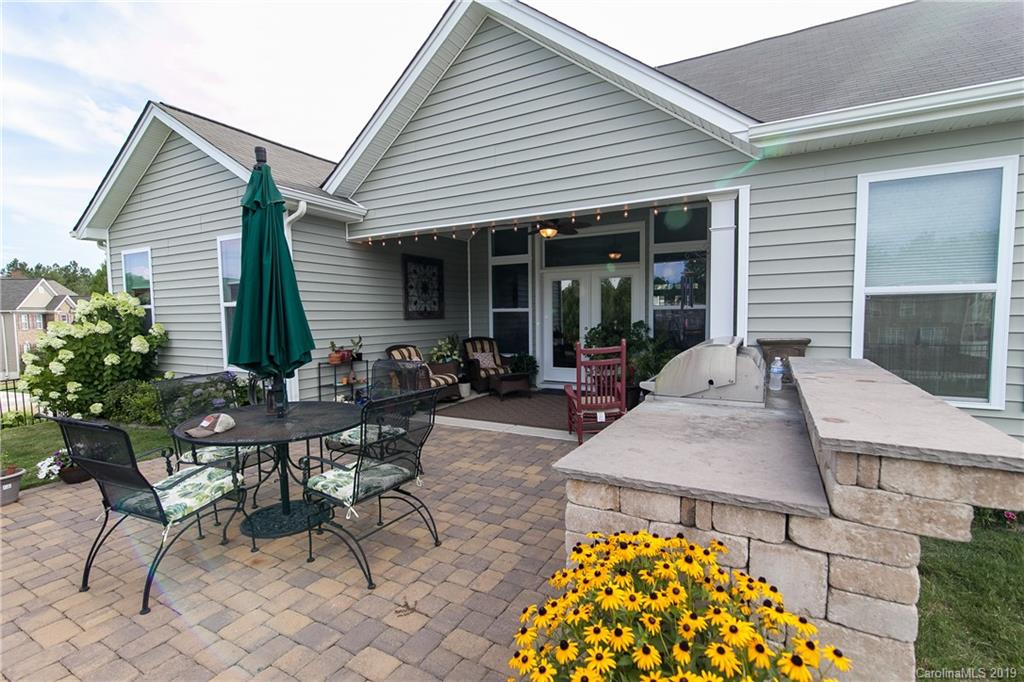 79026 Ridgehaven Road Lancaster, SC 29720 - Photo 27 of 30 a view of a patio with table and chairs and potted plants