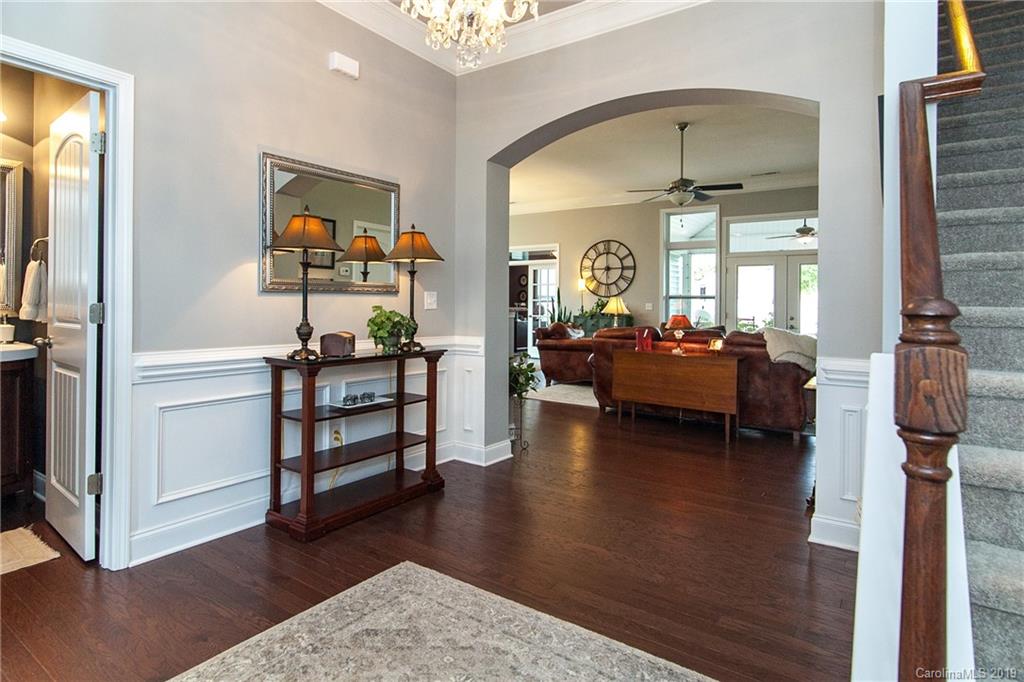 79026 Ridgehaven Road Lancaster, SC 29720 - Photo 5 of 30 a living room with furniture and a chandelier