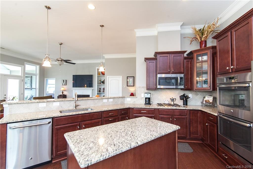 79026 Ridgehaven Road Lancaster, SC 29720 - Photo 6 of 30 a kitchen with a sink stove and cabinets