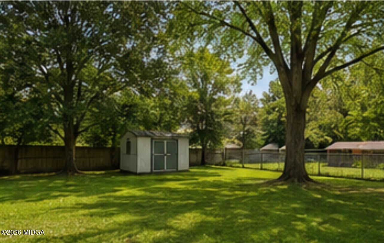 1624 Randall Road Macon, GA 31206 - Photo 5 of 5 a view of a house with a backyard