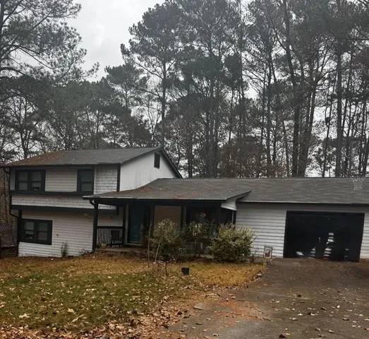 a front view of a house with yard