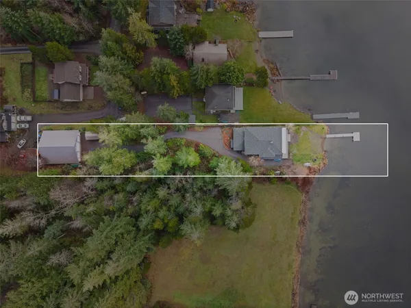 an aerial view of house with yard swimming pool and outdoor seating