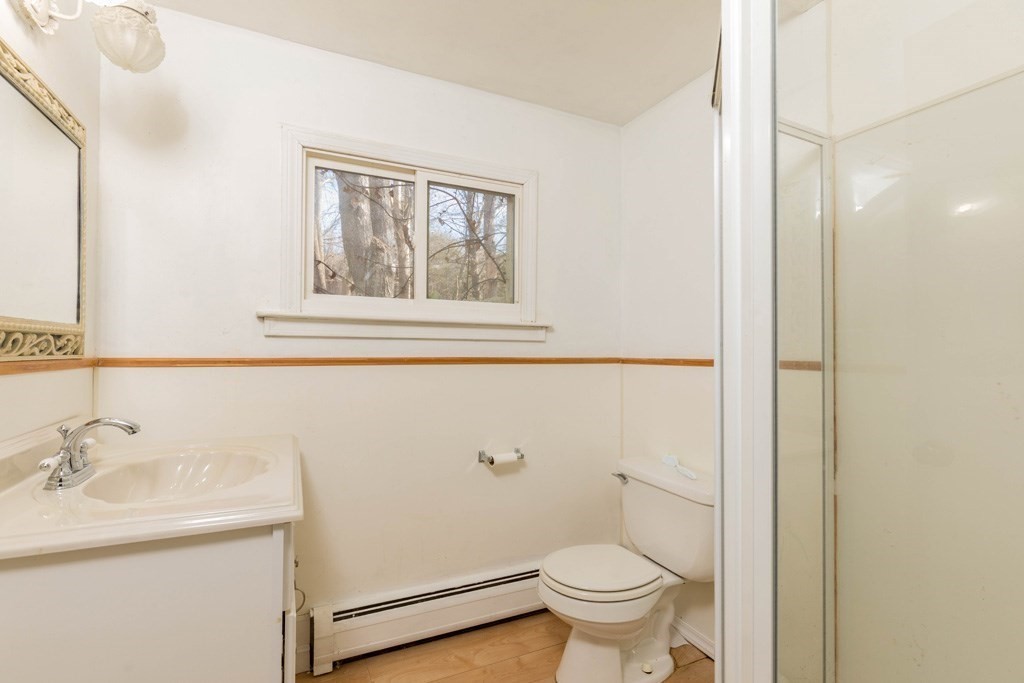 64 Hobbs Road Princeton, MA 01541 - Photo 13 of 22 a bathroom with a sink toilet and a mirror