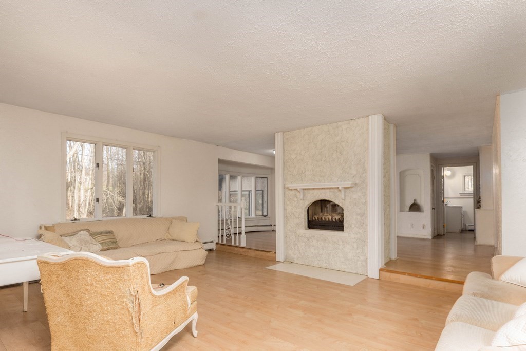 64 Hobbs Road Princeton, MA 01541 - Photo 8 of 22 a living room with furniture and a fireplace