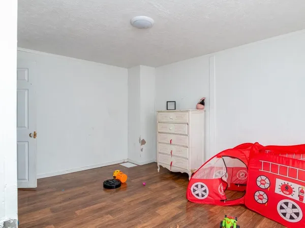 a front view of a house with outdoor seating