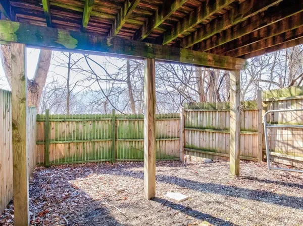 a kitchen with stainless steel appliances granite countertop a stove a sink dishwasher and a refrigerator with wooden floor