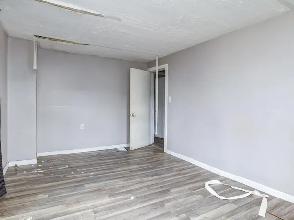 a view of an entryway with wooden floor