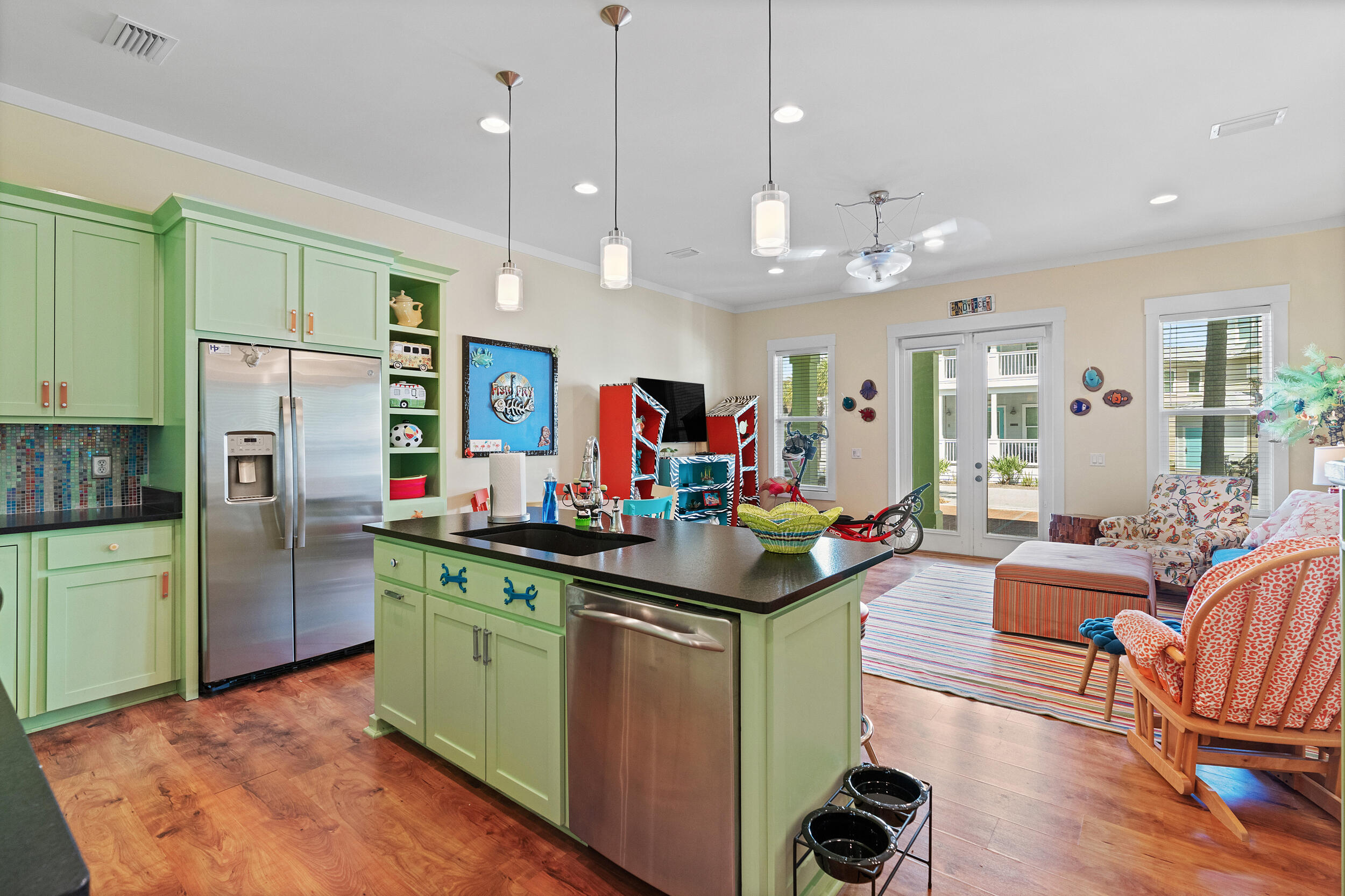 34 Blue Dolphin Loop Inlet Beach, FL 32461 - Photo 17 of 45 a kitchen that has a lot of cabinets a sink stainless steel appliances and a dining table