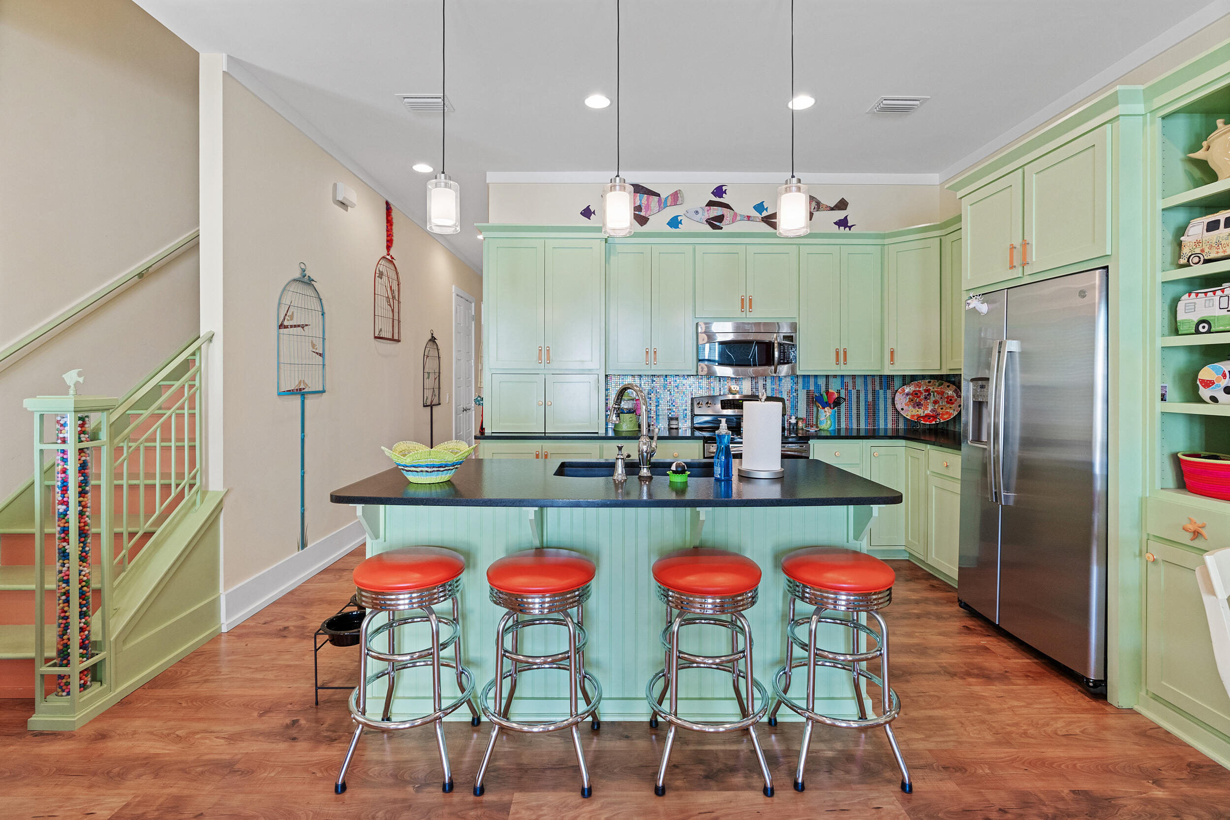 34 Blue Dolphin Loop Inlet Beach, FL 32461 - Photo 18 of 45 a kitchen with stainless steel appliances granite countertop a dining table chairs stove and sink